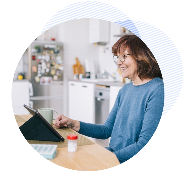 older female patient smiling while talking online with her provider